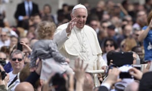 Pope Francis greets people as he makes a tour of St Peter’s Square, the Vatican