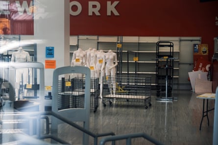 empty shelves and bare mannequins in a closed store