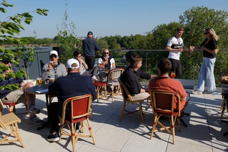 Spectators in the top-level hospitality tier enjoy a drink over the Thames in the new Riverside Stand.