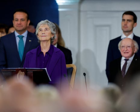 Catherine Connolly listens to the national anthem after her inauguration ceremony as Ireland's 10th president in Dublin Castle.