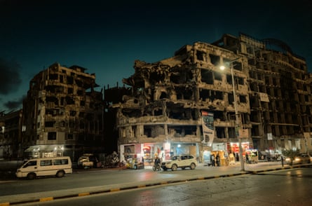 A cafe on the ground floor of a ruined building in Homs.