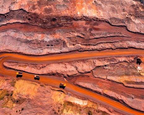 Aerial view of open pit iron ore and heavy mining equipment.