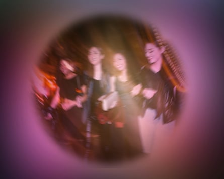 A blurred image of women stepping on a street