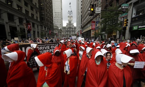 Women dressed as handmaids protest against US vice-president Mike Pence in Philadelphia, 23 July