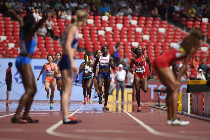 Left to right: Japan’s Kana Ichikawa, Bahamas’s Christine Amertil, Britain’s Anyika Onuora and USA’s Jessica Beard run with the baton toward their waiting team-mates in the qualifying round of the women’s 4x400 metres relay