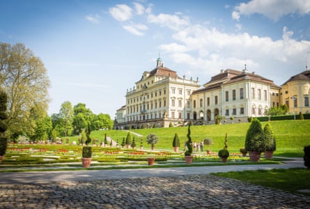 Palace in with baroque garden under a blue sky