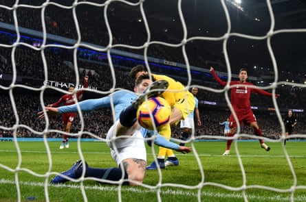 January 3: John Stones of Manchester City makes a goal-line clearance against Liverpool at the Etihad Stadium.