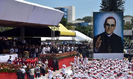 Catholics carry clothes that belonged to the late archbishop Óscar Romero during a mass celebrating his beatification at San Salvador’s main square on Saturday.