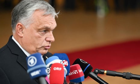 Hungary's Prime Minister Viktor Orban addresses the press as he arrives for a EU leaders Summit at The European Council Building in Brussels on October 26, 2023.