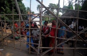 People from Dhinkia village in Jagatsinghpur district, India, block off a road following clashes with the police.