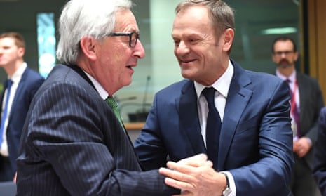 The commission president, Jean-Claude Juncker, greets the president of the European council, Donald Tusk, in Brussels.