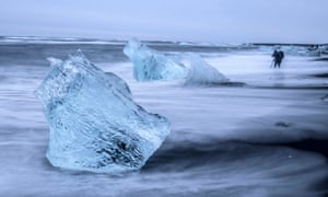 Beach in Iceland with photographer in distance