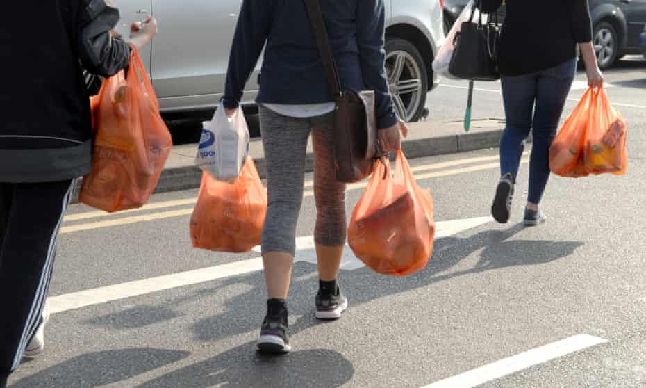 Shoppers carrying plastic bags