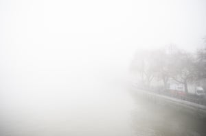 Thick fog envelops the river Thames