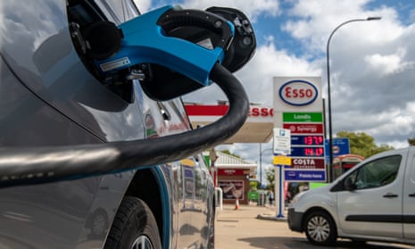 An electric car charges at a Motor Fuel Group station while petrol and diesel pumps are closed on the Esso forecourt because of the fuel crisis 