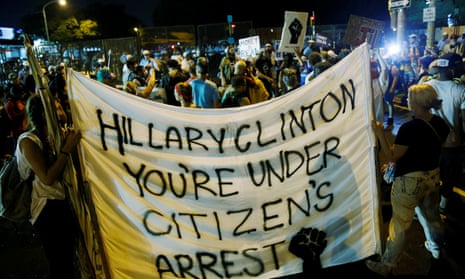 Activists hold a banner against Hillary Clinton amid protest outside the Wells Fargo Center on the final day of the Democratic national convention in Philadelphia on Thursday.