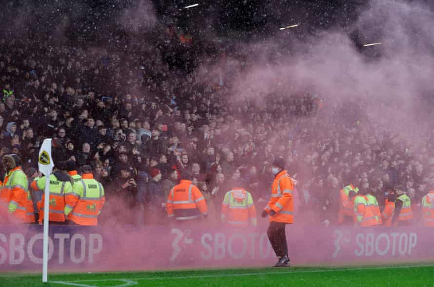 A smoke bomb is let off by Manchester United fans after their first goal.