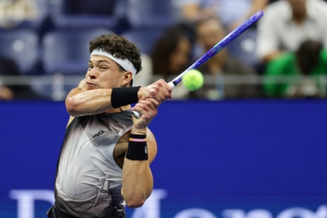 Ben Shelton returns against Carlos Alcaraz during their US Open quarter-final at Flushing Meadows.