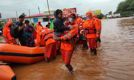 National disaster response force personnel rescue people in the Chiplun area in the western Indian state of Maharashtra on Friday