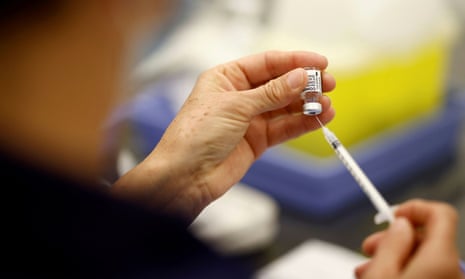 A medical worker prepares a dose of the Pfizer-BioNTech Covid-19 vaccine in a vaccination centre in Saint-Nazaire, France.
