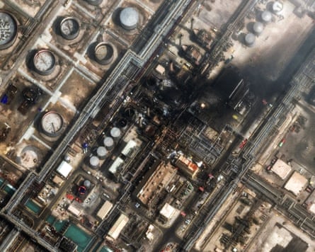 Satellite image showing black smoke rising from buildings/infrastructure