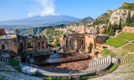 The Greek theatre at Taormina, with the town centre and Mount Etna behind.