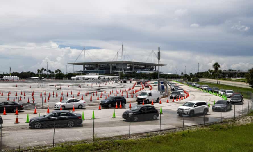 Cars line up at a rapid coronavirus testing site at Hard Rock Stadium in Miami Gardens near Miami.
