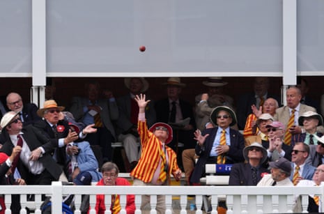An MCC member tries to catch a ball.