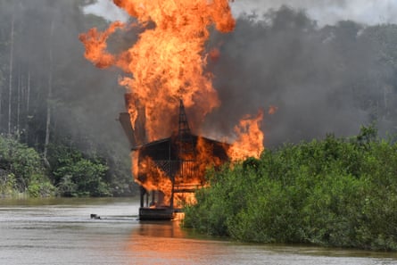 Brazilian soldiers destroy mining barges belonging to illegal gold miners in the Javari Valley