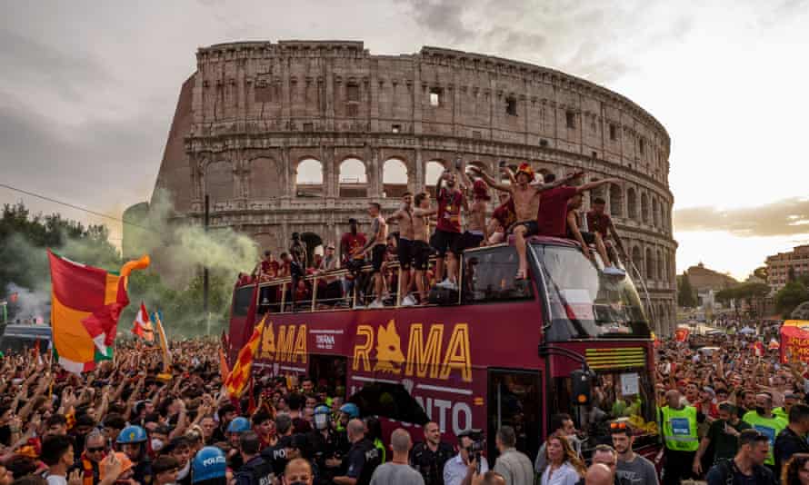 Roma players and fans celebrate winning the Europe Conference League during an extraordinary open-top bus parade.