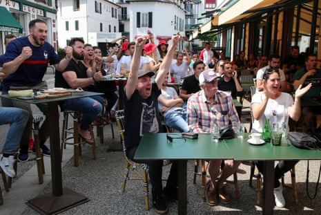 Supporters watching the game on a tv outside a bar in Saint Jean de Luz, southwestern France.