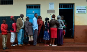 Voters queue at a polling station at Mutomo primary school in Kiambu.