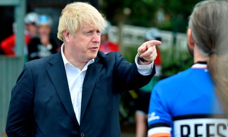 Boris Johnson talks to members of a local cycling clubin Beeston, on 28 Jul 2020.