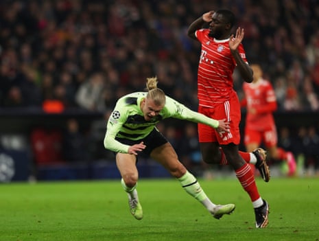 Bayern Munich's Dayot Upamecano displays the internationally know gesture of “I didn’t touch him ref!”
