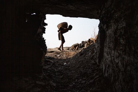 Vishal Kumar exits the tunnel with a bag of coal