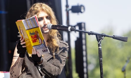 A person in drag reads children’s book Annie’s Plaid Shirt to a crowd of people in Boise, Idaho.