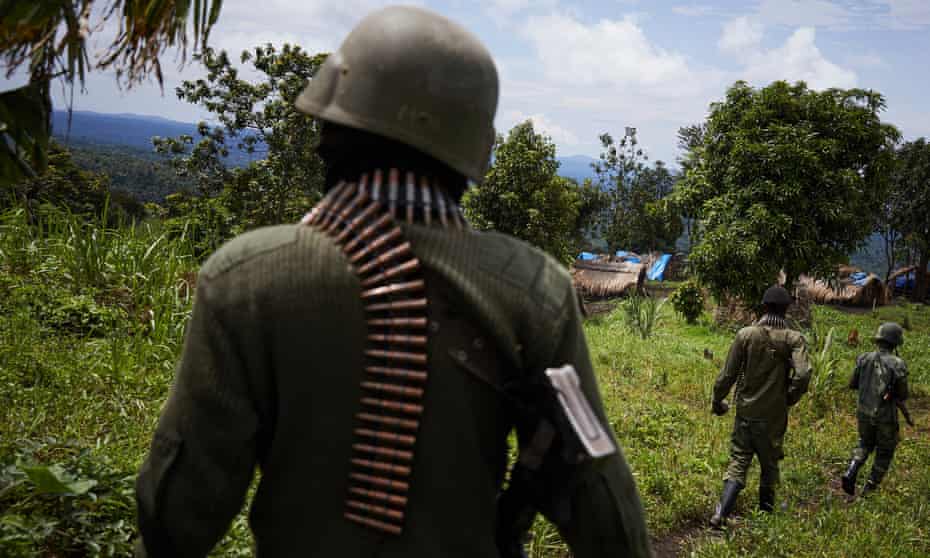 Members of the Congolese national army move near where the ADF militia group operates in North Kivu province.