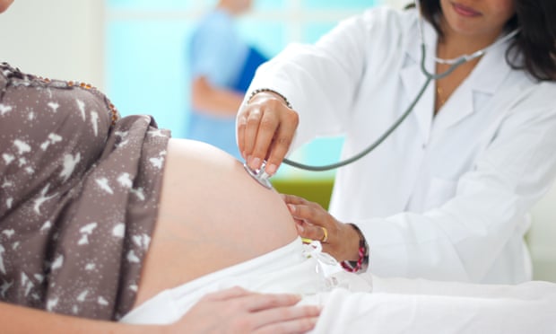 A pregnant woman having a pre-natal check.