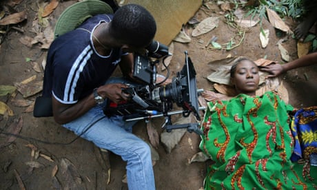 A cameraman films a scene for the movie October 1, a police thriller directed by Kunle Afolayan, at a rural location in Ilaramokin village, southwest Nigeria.