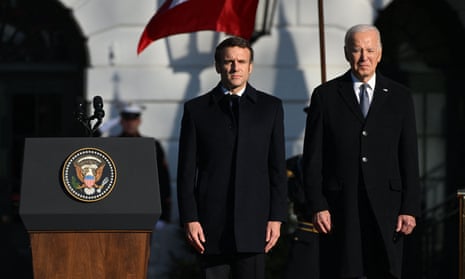Joe Biden and Emmanuel Macron stand for their respective countries’ national anthems at the White House on Thursday.