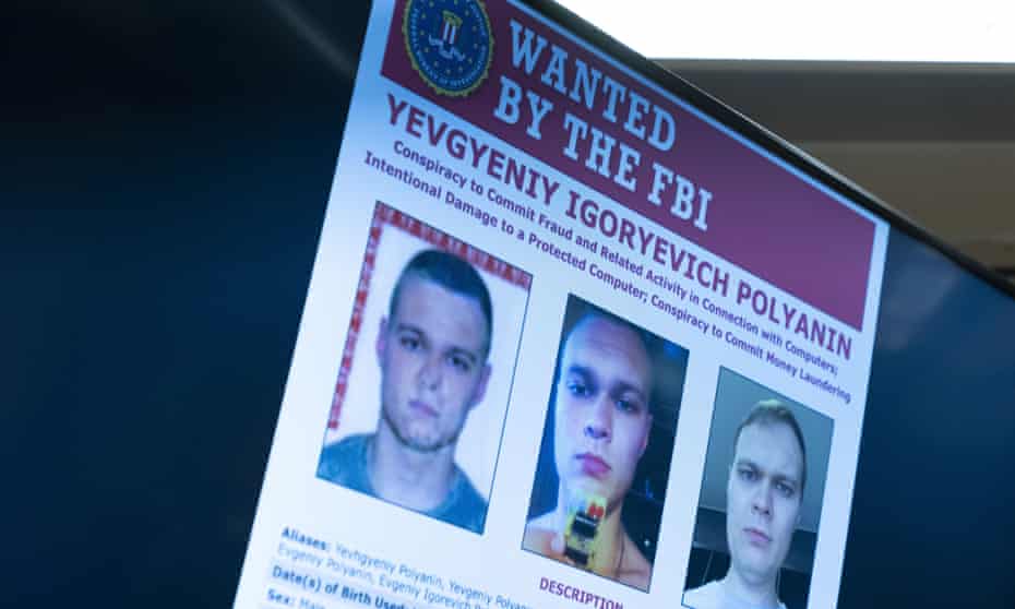 Russian Yevgyeniy Polyanin - wanted poster for FBI on screen at White House