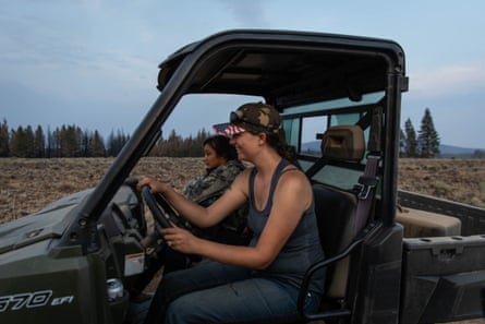 Valerie O’Dai drives an all-terrain vehicle to deliver water and supplies to residents affected by the Bootleg fire north of Bly, Oregon.