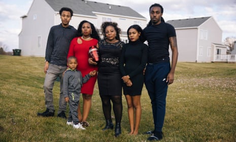 Carlene Veal and her family pose with the ashes of Walter Veal in University Park, Illinois. From left: Jordan Veal, Devohnte Harper Jr, Doreal Veal, Carlene Veal, Whitney Green and Carrice High.