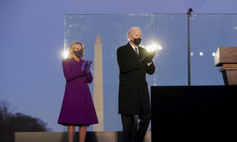 Joe Biden and Jill Biden at the Lincoln memorial reflecting pool during a Covid-19 memorial