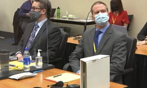 Defense lawyer Eric Nelson (left) and defendant Derek Chauvin (right) in court in Minneapolis.