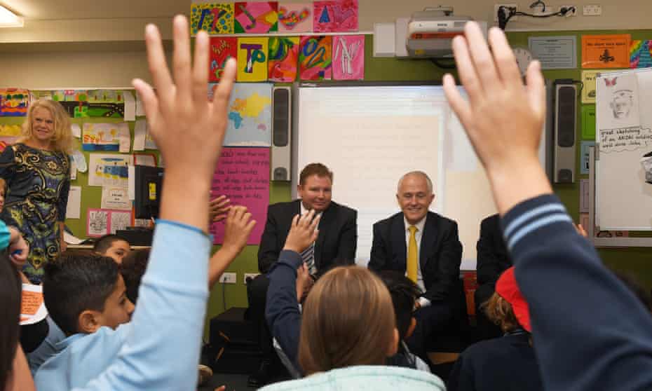 Malcolm Turnbull and Craig Laundy (centre left) with students at Strathfield North public school in Sydne