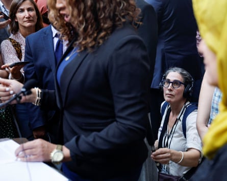 Sarah Koenig with her microphone at the Baltimore City circuit courthouse as the judge overturns Adnan Syed’s conviction on 19 September 2022.