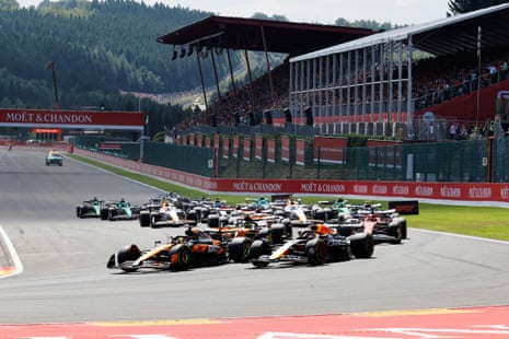 Drivers turn into the first corner.