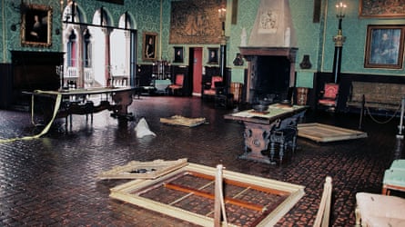 A room after a huge art heist, with frames on the floor.
