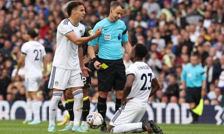 Luis Sinisterra is shown his first yellow card by Stuart Attwell